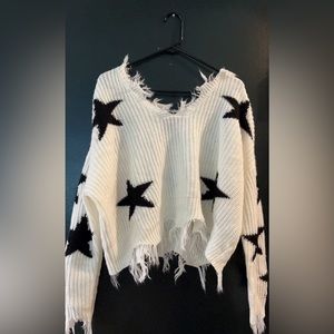 White sweater with black stars, only worn once! Great soft material! No stains!